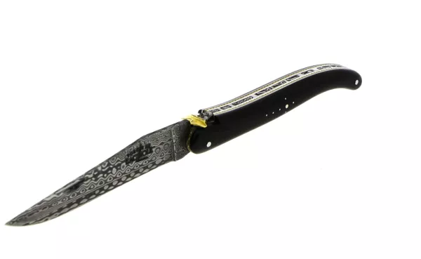 Custom folding knife with ebony handle, pirate skull, and tricolor brass hat